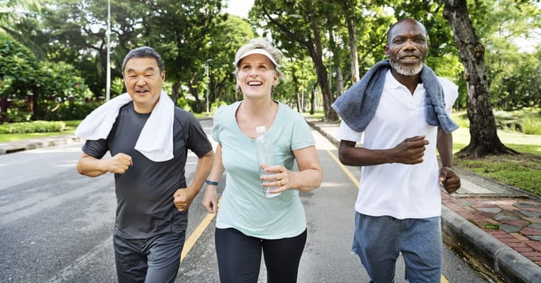 Residents jogging in a sunny outdoor park