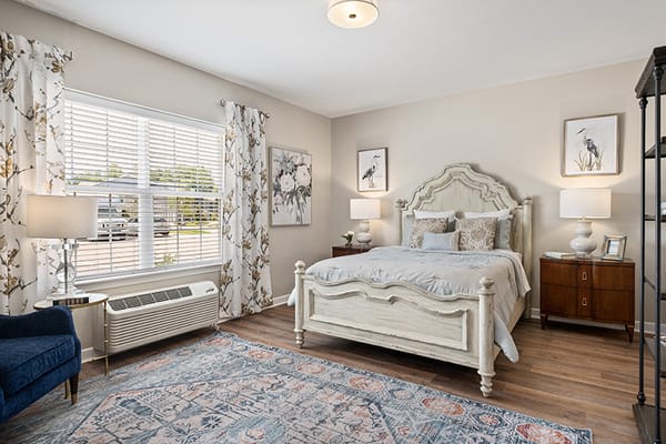 Brightly decorated resident room with furnishings