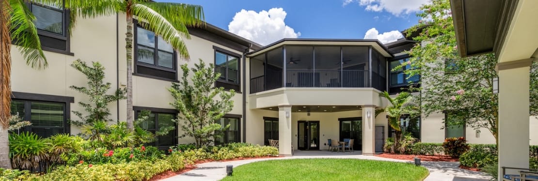 Outdoor courtyard of a senior living facility with seating