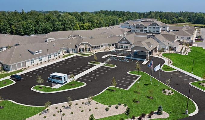 Aerial view of Quincy Place Senior Living with parking area