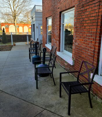 Outdoor seating area with chairs near the facility