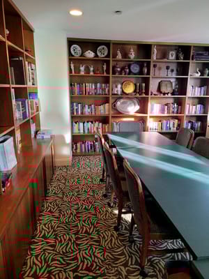 Interior view of a library area with shelves and tables