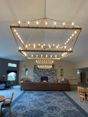 Interior view of a cozy common area with lighting fixture