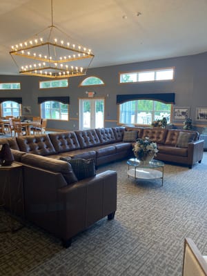 Cozy common area with a large brown sectional sofa