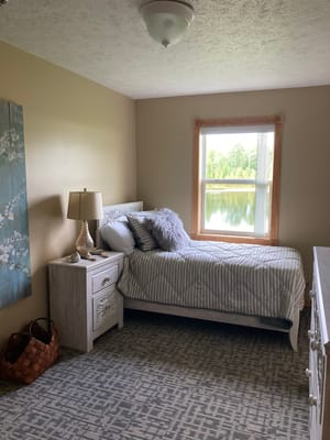 Cozy resident room with lake view and decor