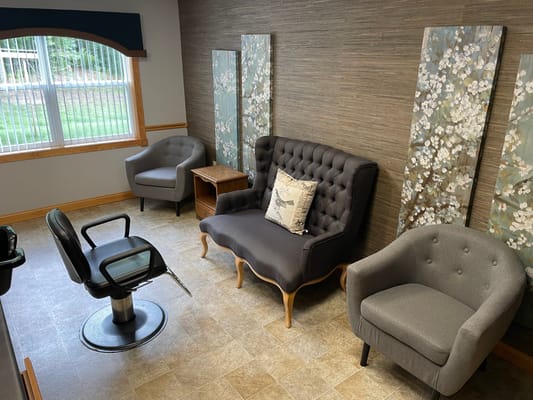 Interior space featuring a salon setup with seating.