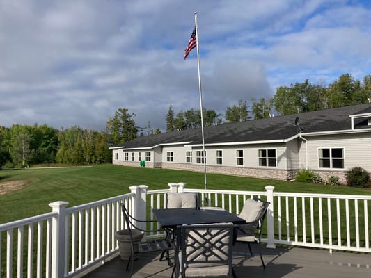 View of the senior living facility exterior with seating area