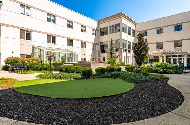 Outdoor courtyard with gardens and seating area