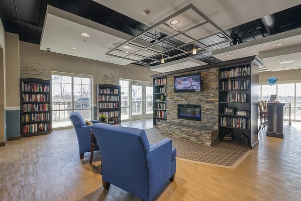 Bright common area with bookshelves and seating