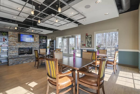 Bright common area with tables and chairs