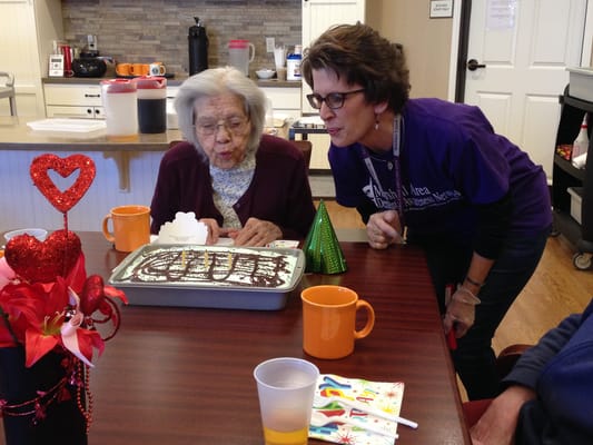 Residents celebrating with cake and decorations