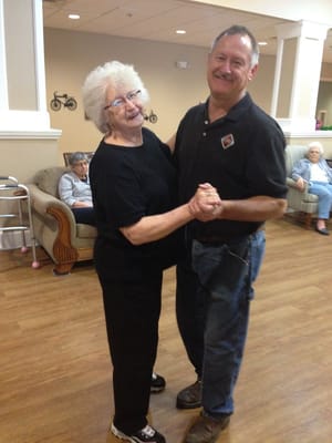 Residents dancing and enjoying time together in a common area