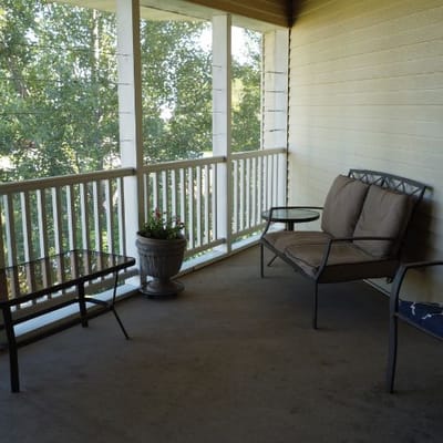 Cozy seating area on a porch with plants
