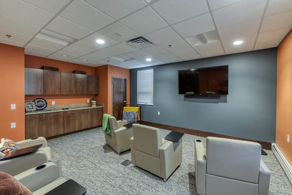 Common area with seating and a television