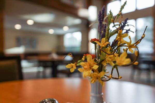Close-up of a floral centerpiece on a dining table