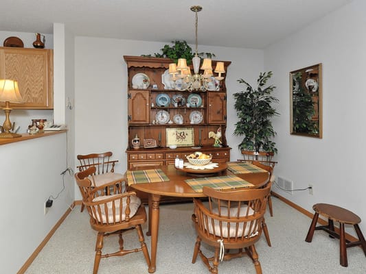 A cozy dining area with a wooden table and chairs