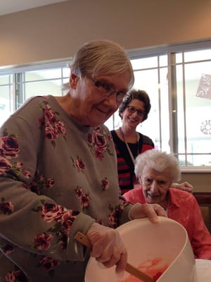 Residents engaged in a cooking activity together