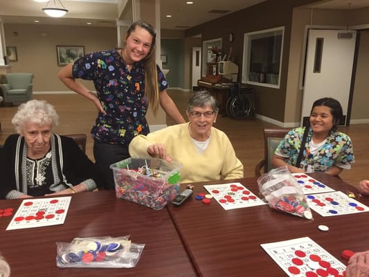 Residents playing bingo with staff engagement