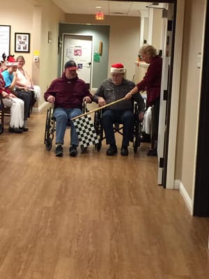 Residents participating in a fun activity in the hallway
