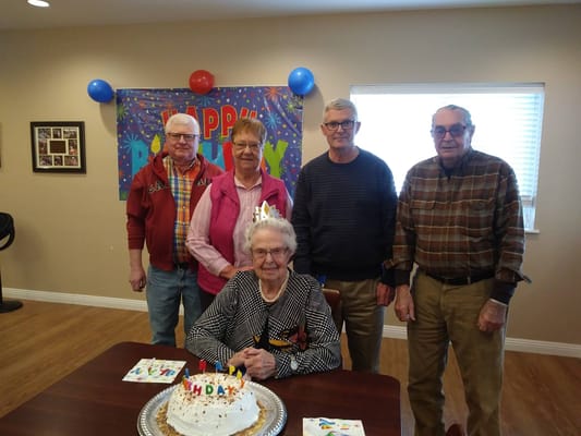 Residents celebrating a birthday with cake