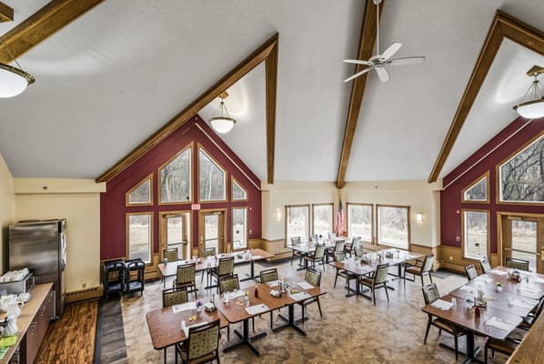 Interior view of a spacious dining room with tables