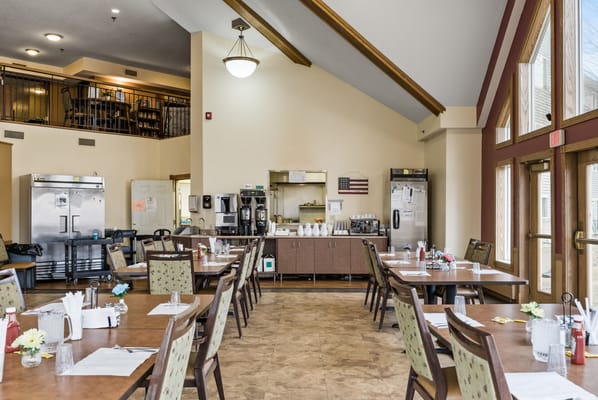 Dining room setup with tables and chairs