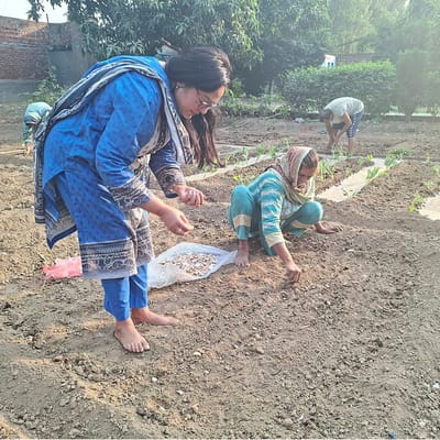 Residents engaging in gardening activities outdoors