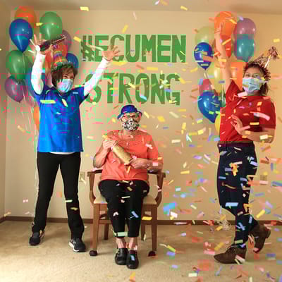 Residents and staff celebrating with confetti