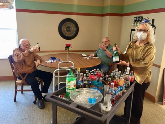 Residents enjoying a celebration with drinks