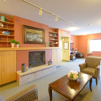 Cozy common area with a fireplace and seating