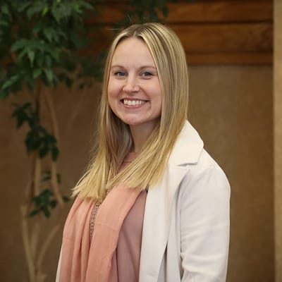 Staff member smiling in a common area