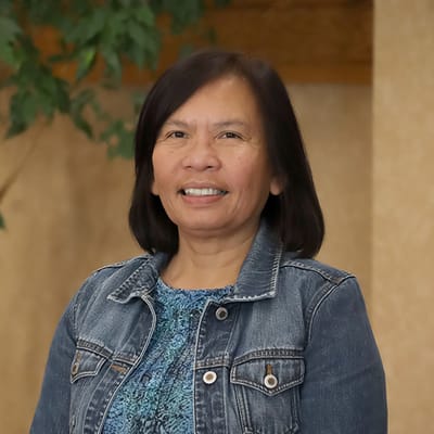 Smiling staff member in a facility interior