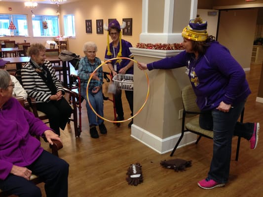 Residents participating in a fun activity with hula hoops