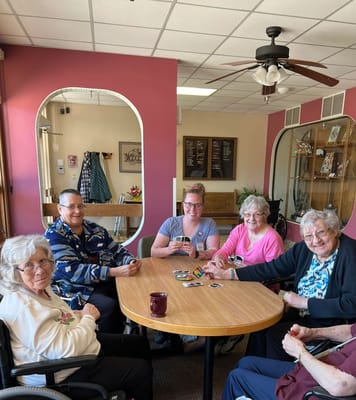 Residents playing cards in a common area