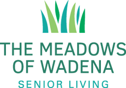 Facility logo with green grass design and facility name