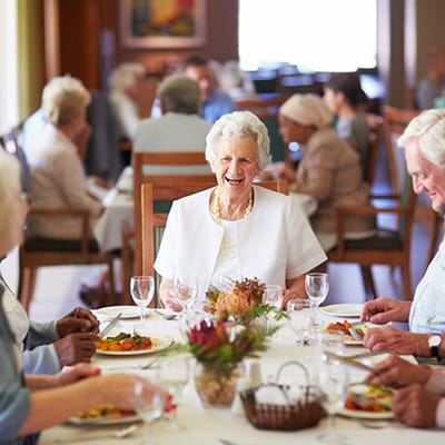 Residents enjoying a meal in the dining room