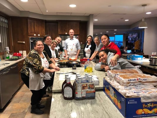 Staff and residents participating in a cooking activity