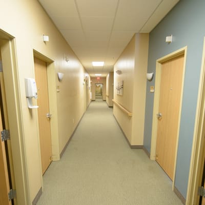 Hallway with doors leading to resident rooms