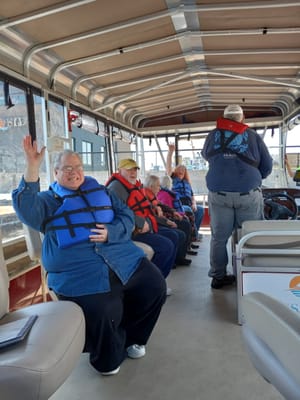Residents enjoying a boat ride on a scenic outing
