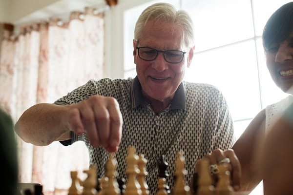 Residents engaged in a game of chess
