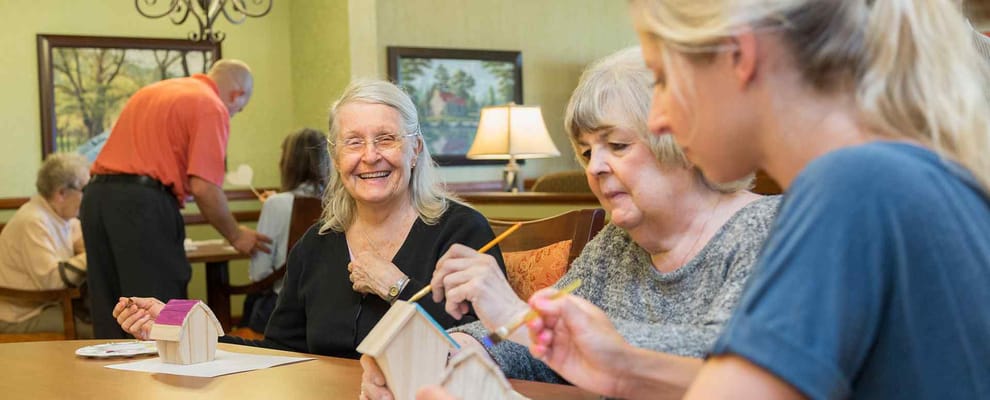 Residents engaging in a craft activity together