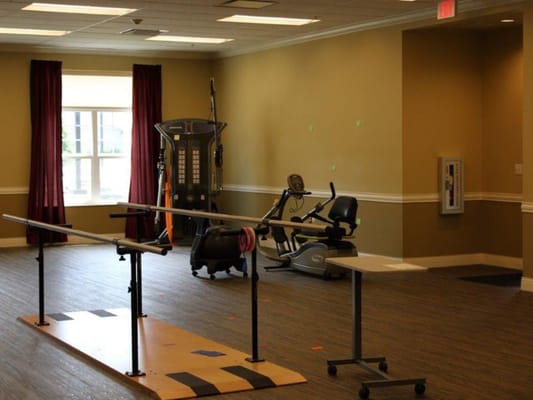 Physical therapy room with exercise equipment