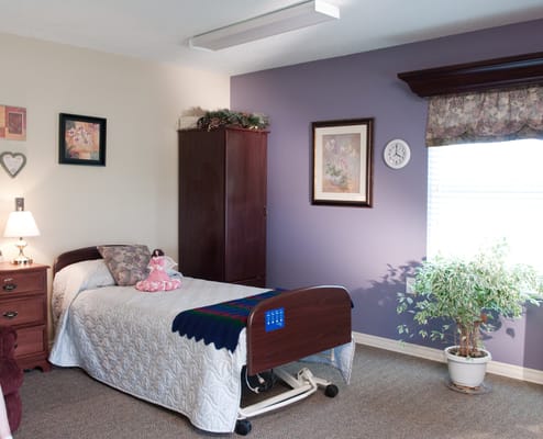 Comfortable private bedroom in a senior care facility