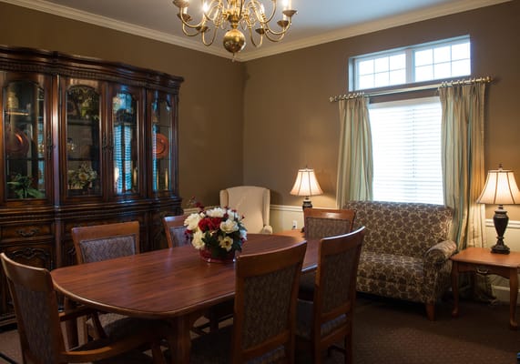 Cozy dining room with wooden table and chandelier