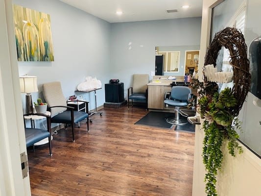 Interior view of a salon with seating and mirrors