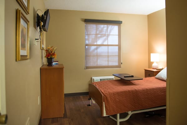 Cozy resident room with a bed and furniture