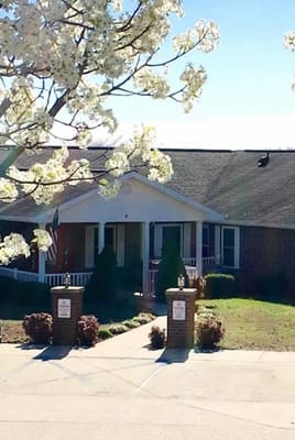 The entrance of Shepherd's View Assisted Living with flowers