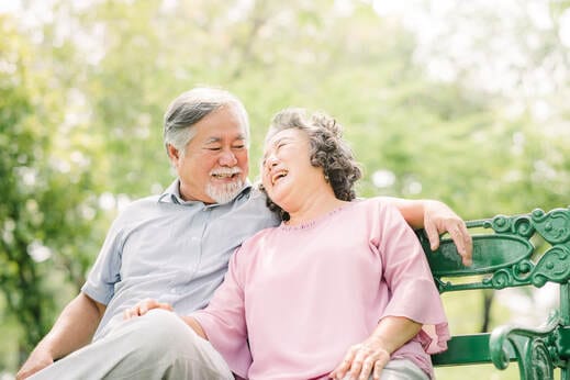 Happy senior couple enjoying each other's company in a garden