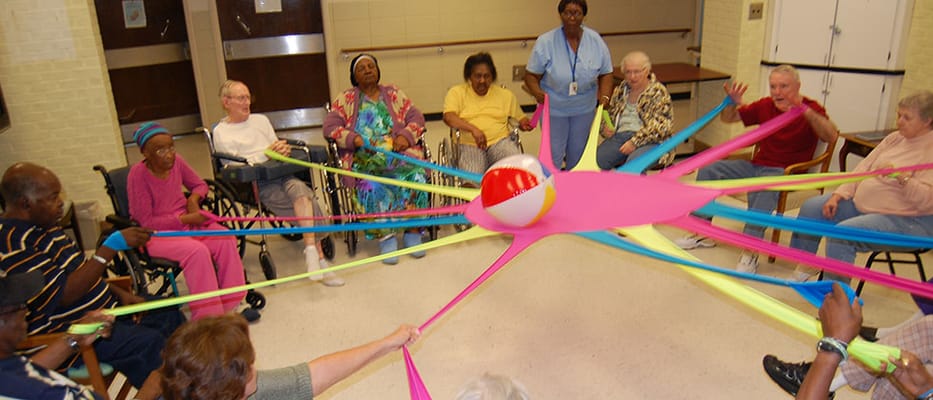 Residents participating in a group activity with elastic bands