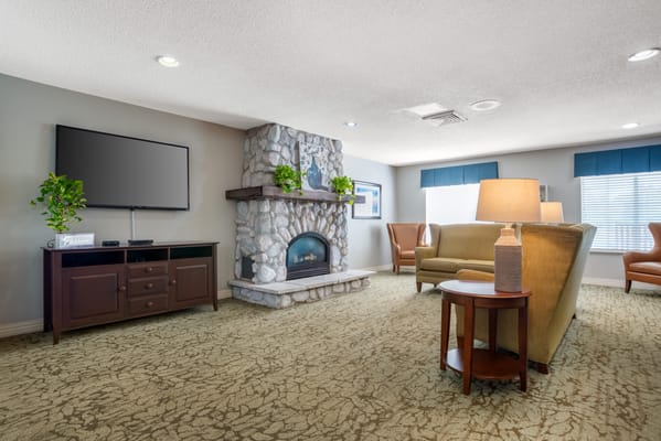 Cozy common area with seating and a fireplace